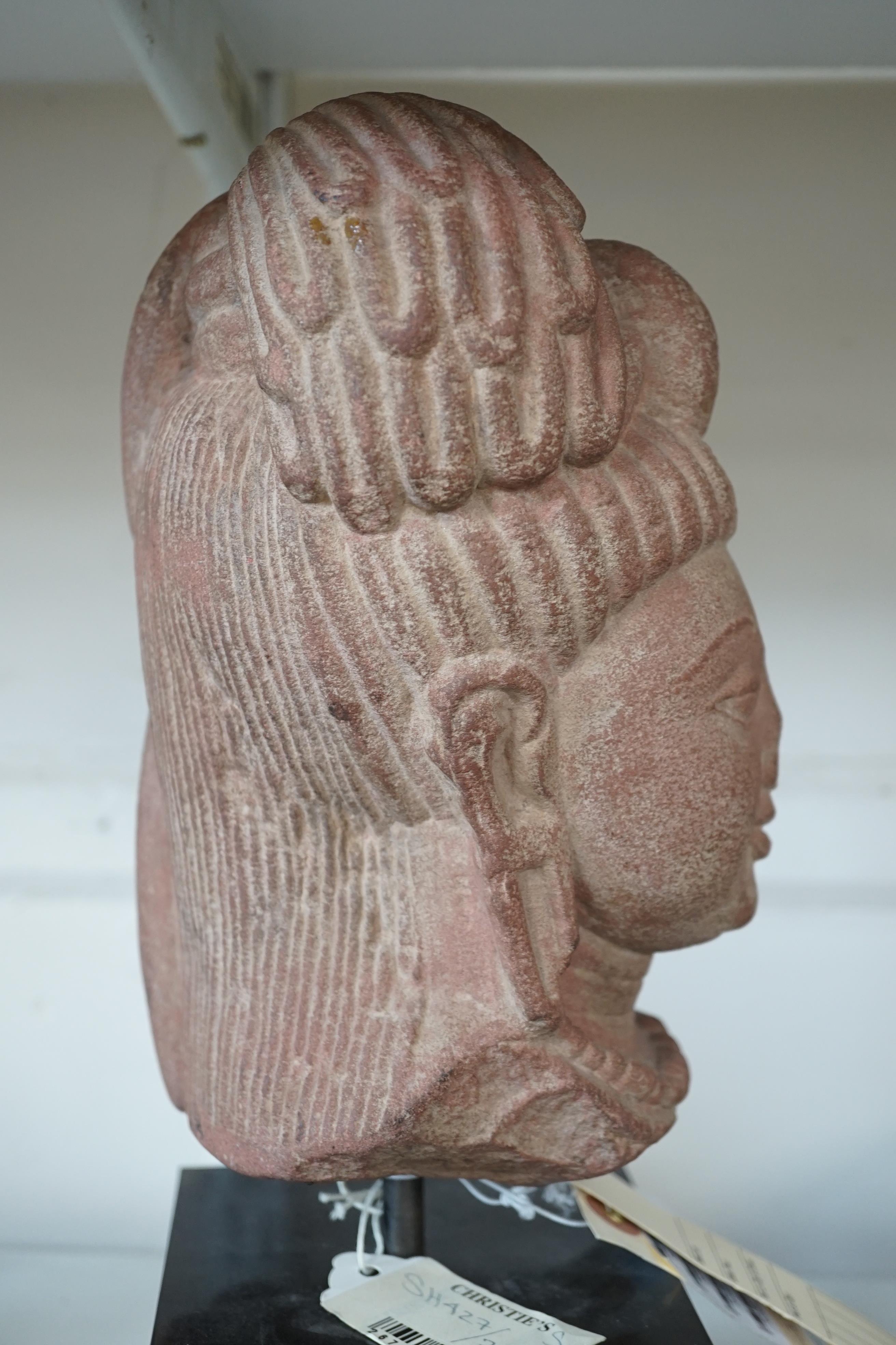 A red stone head of Ardhanarishvara, Muthura region, India, Gupta period, c.5th century A.D.